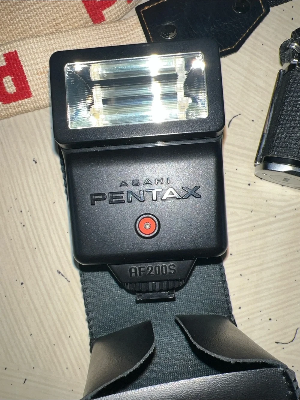 Pentax 35mm Camera with Cream and Red Branded Strap Untested